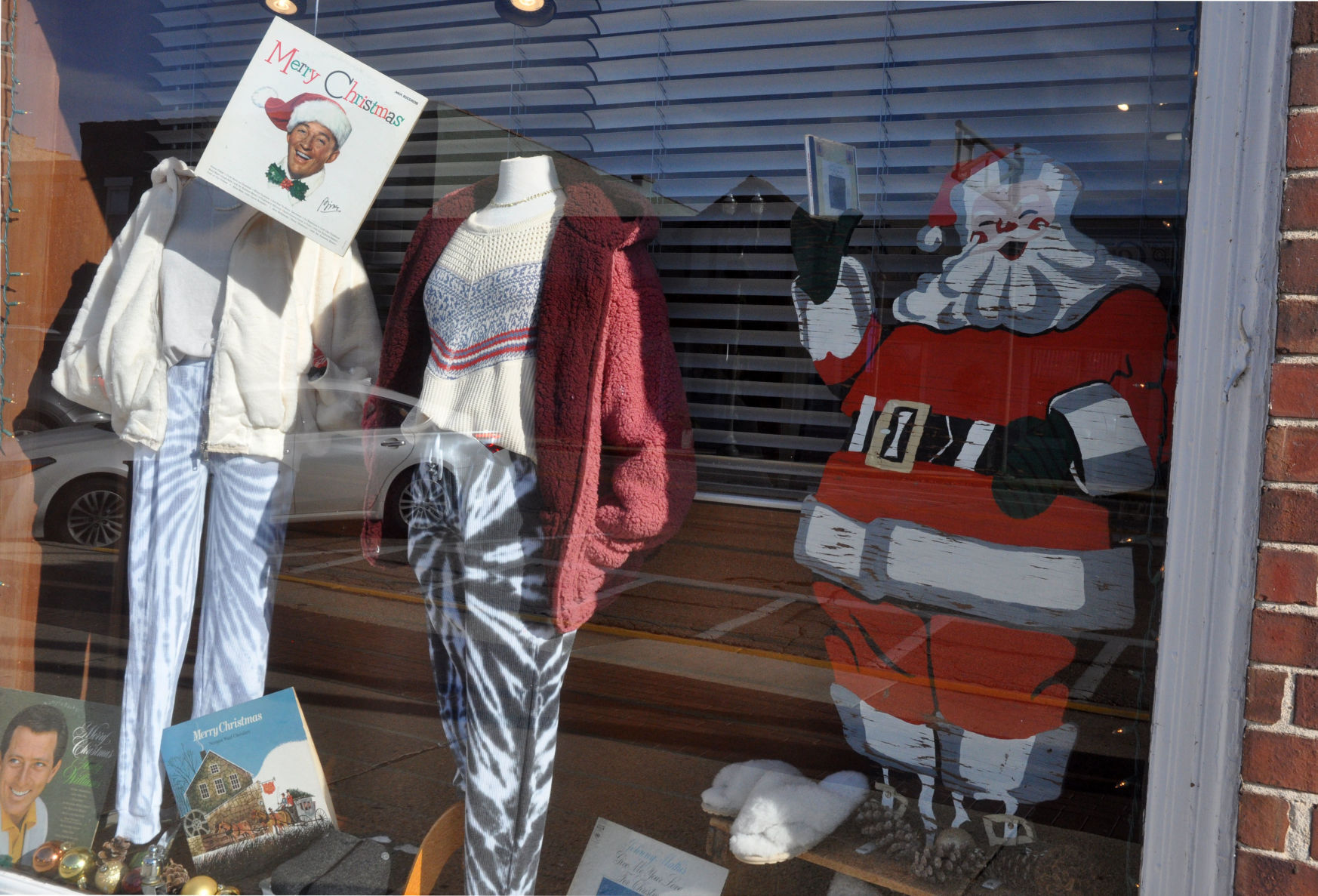 Jayne Boutique, 771 W. Main St. has a cut-out Santa and Christmas albums and books displayed in its window
